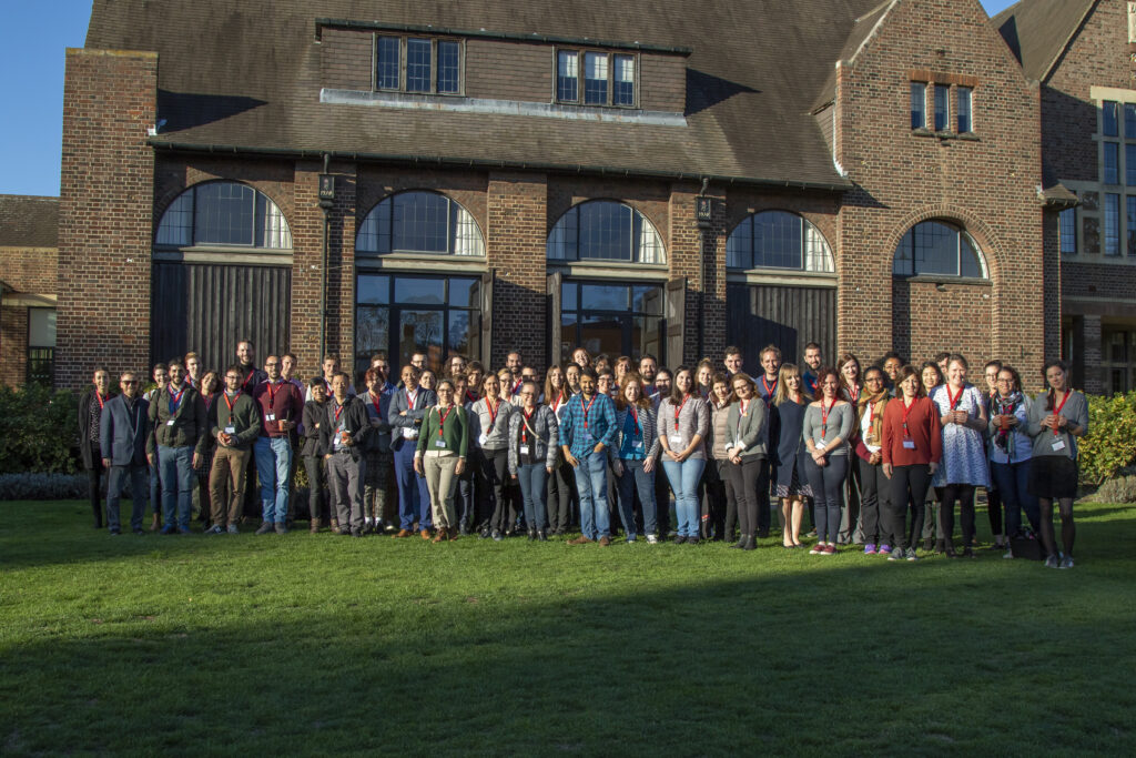 A group of colleagues standing outside the hub of science and technology in Cambridge